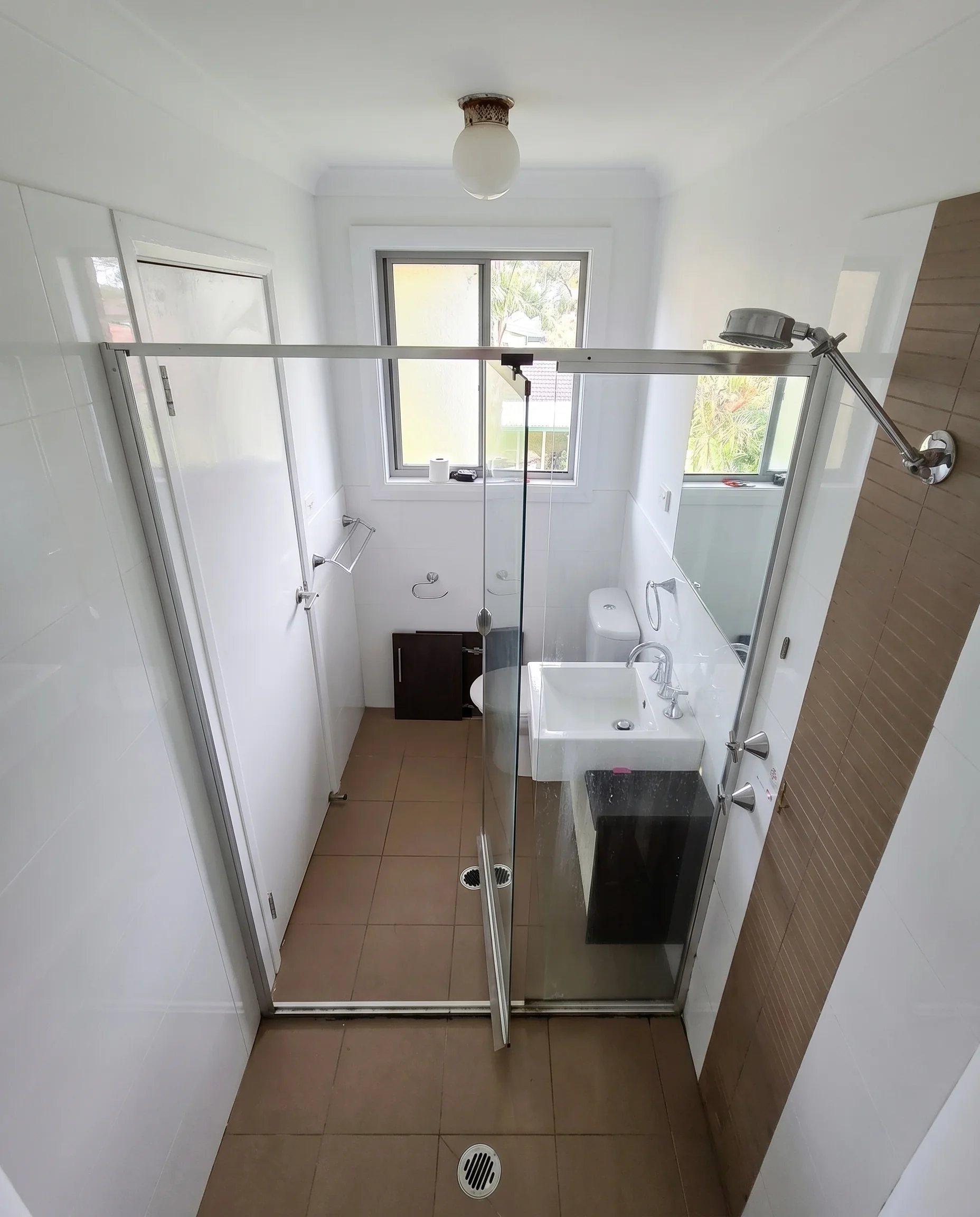Overhead view of glass bifold shower screen enclosure
