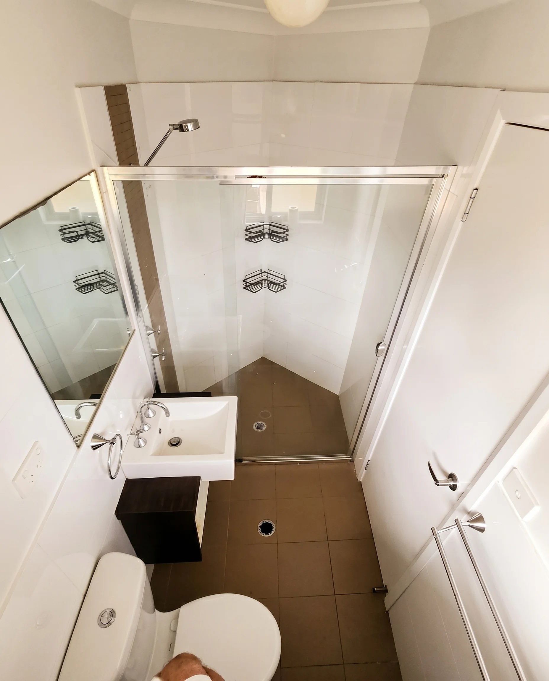 Compact bathroom with shower screen, vanity and toilet