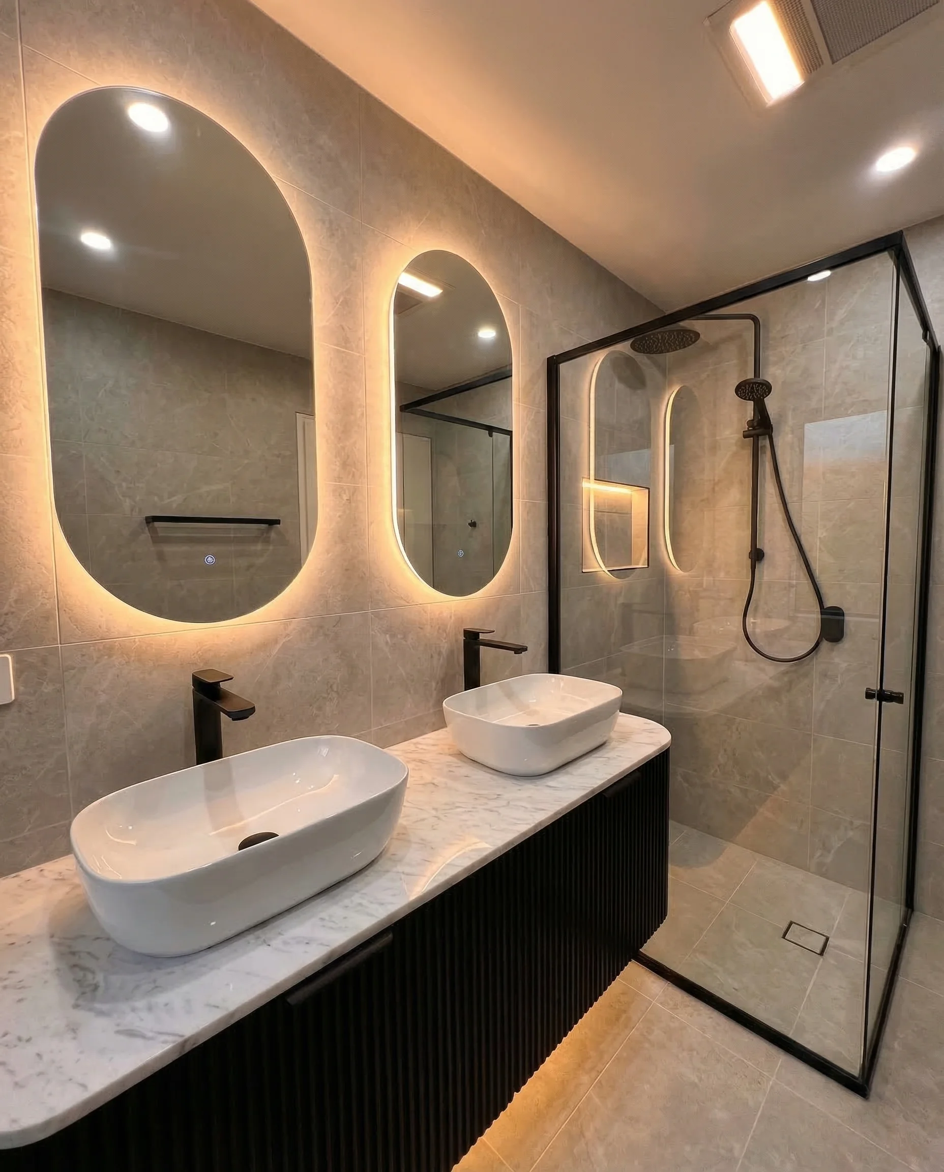 Feature wall tiling with herringbone pattern in bathroom
