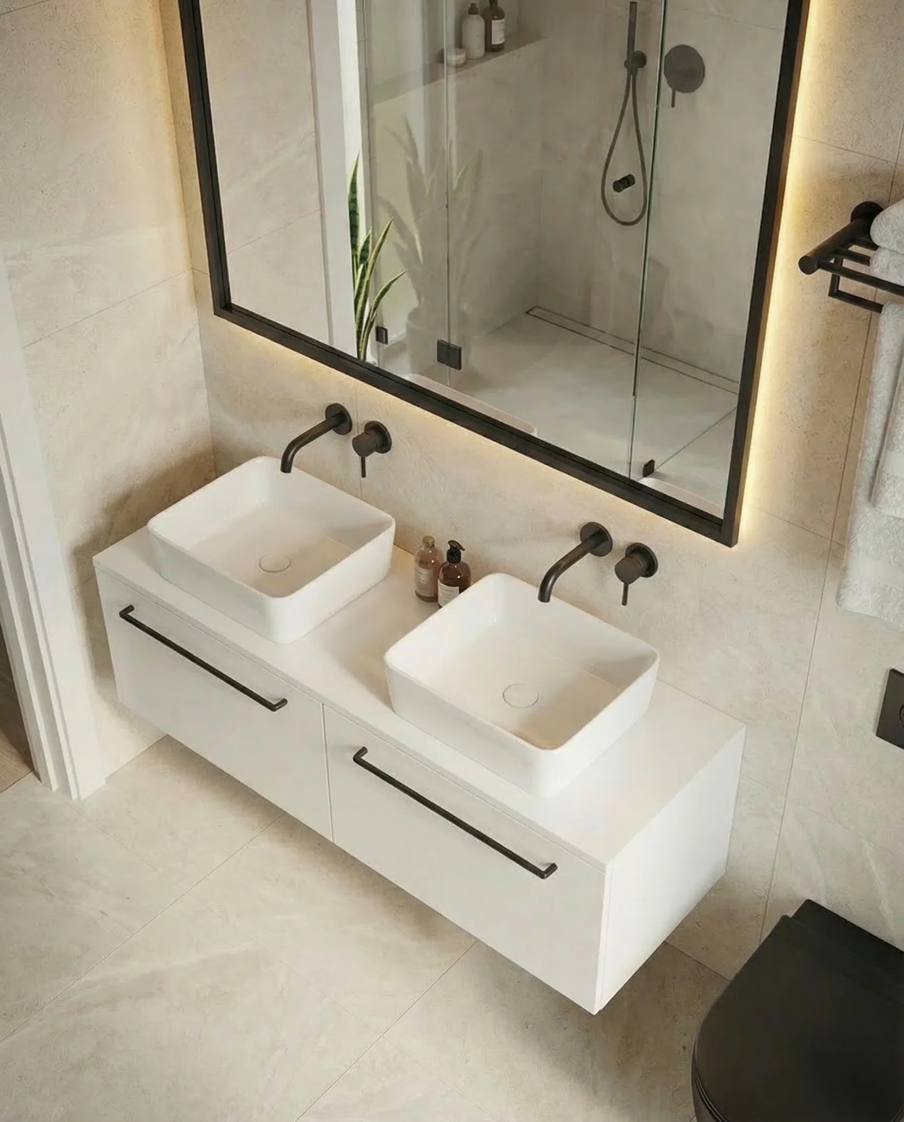 Walk-in shower with floor to ceiling tiles and frameless glass